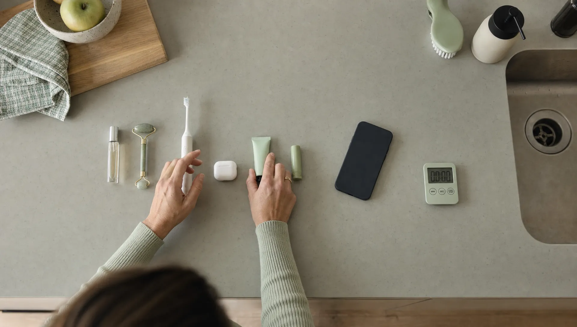 Placing hands on a kitchen counter and repeatedly putting things down demonstrates the ritual associated with OCD.